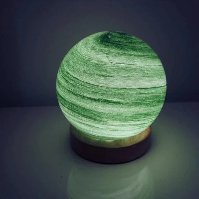 Green spherical lamp on a dark background