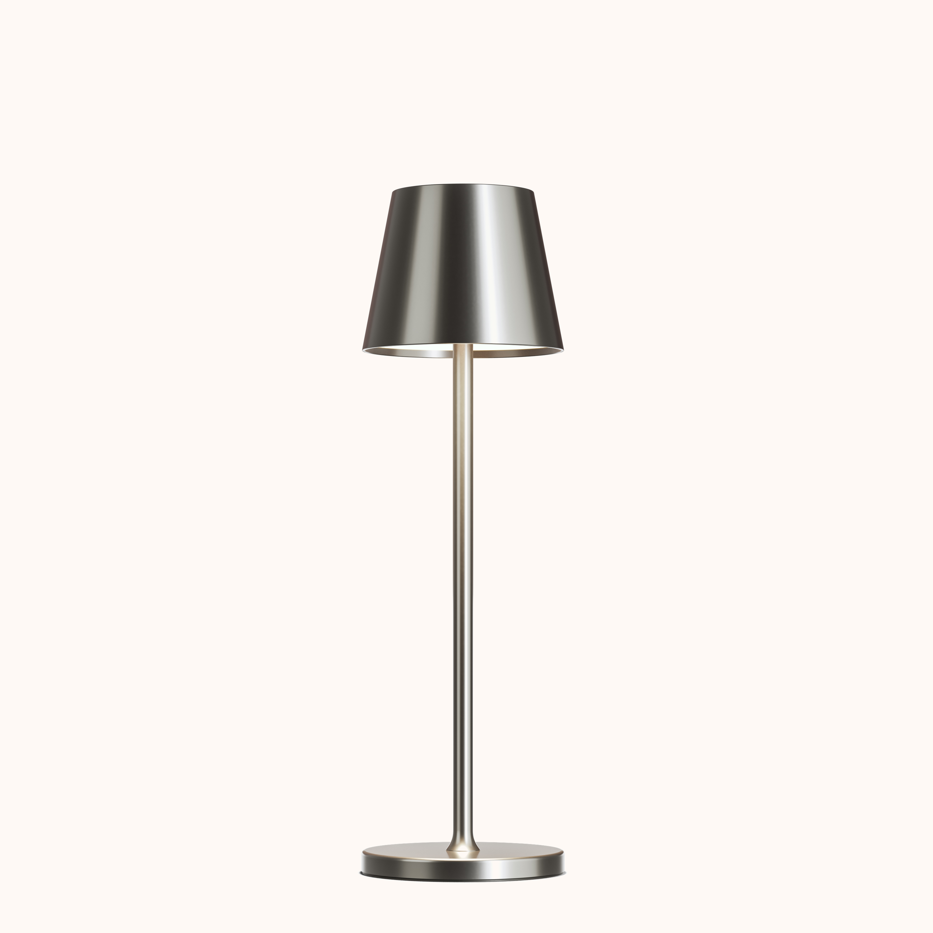 Silver table lamp with a metallic shade on a white background