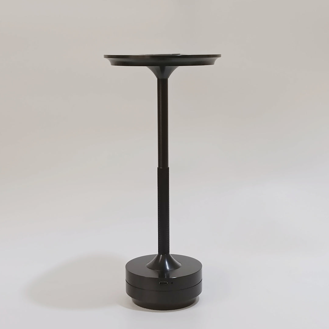 Black pedestal table on a white background