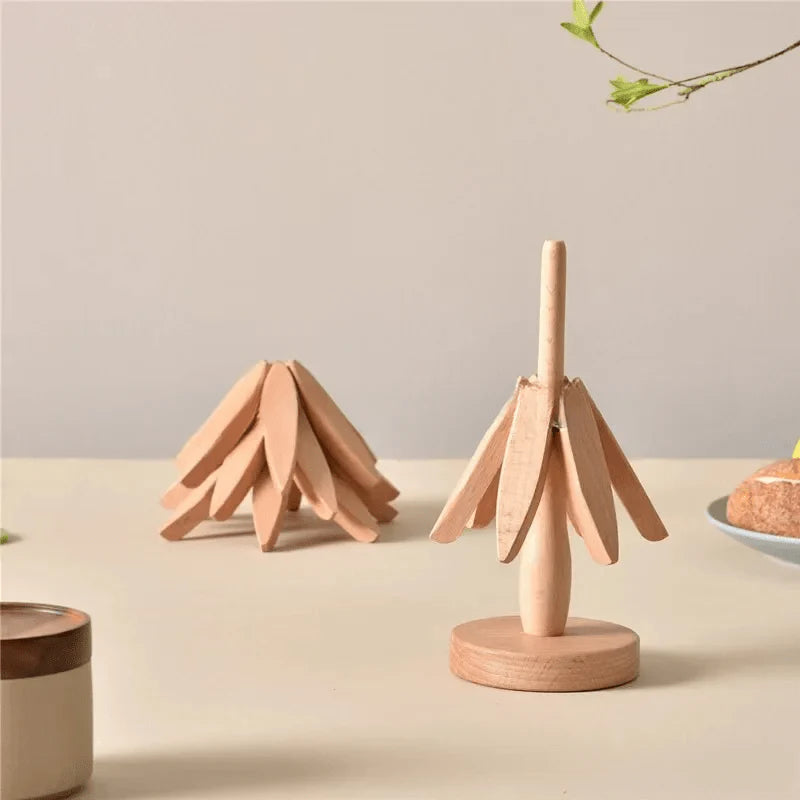 Two wooden tree-shaped stands on a neutral background