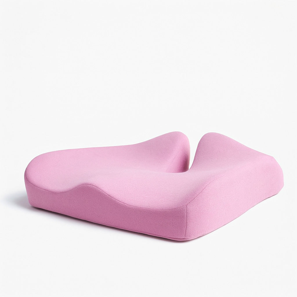 Pink neck pillow on a white background