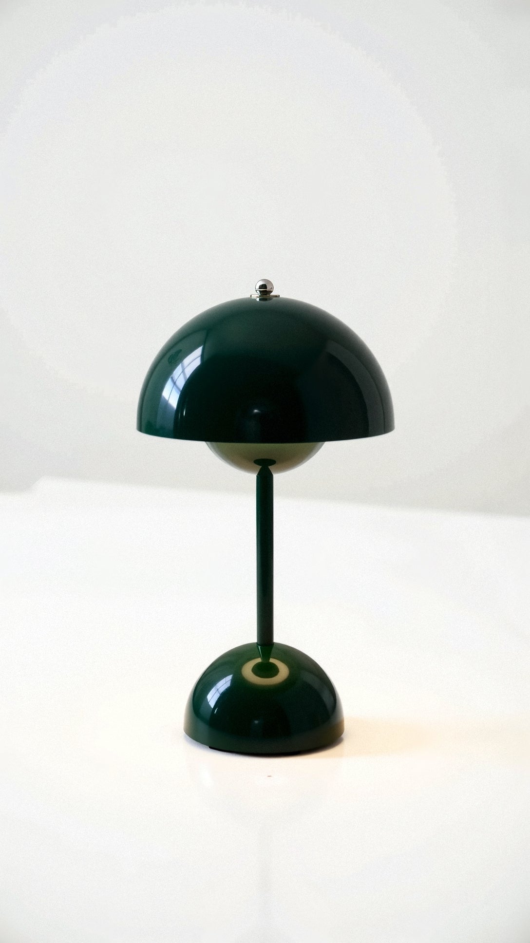 Green table lamp on a white background