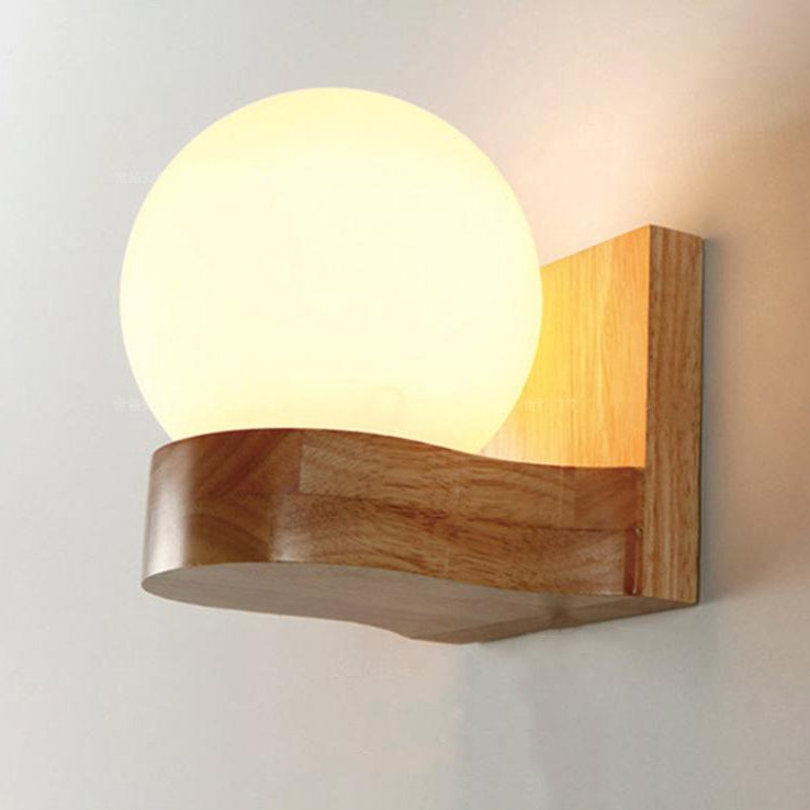 Wooden wall sconce with a round light bulb on a neutral background