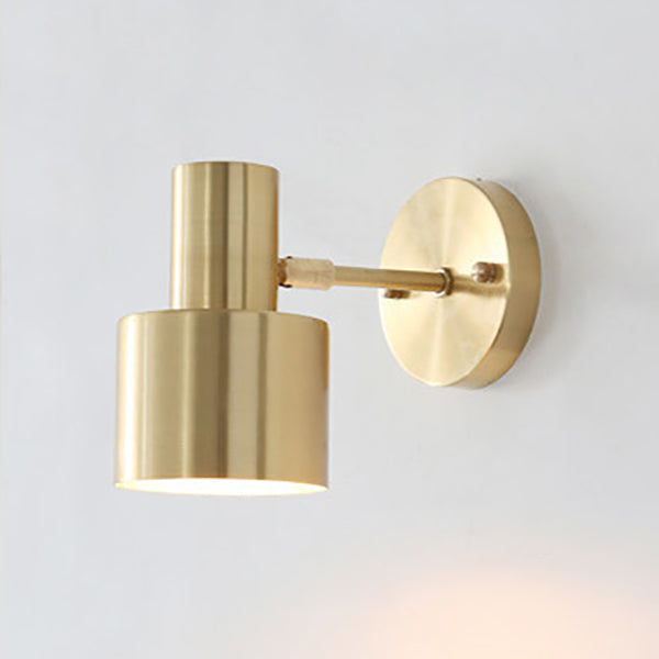 Gold wall-mounted light fixture on a white background