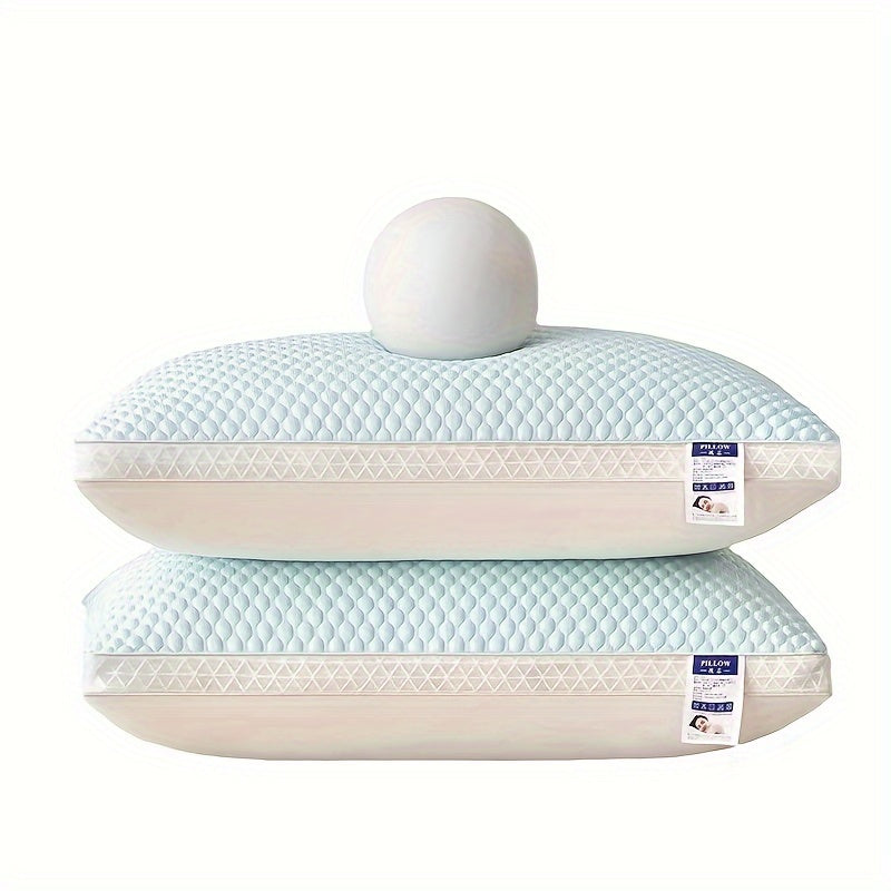Two light blue pillows with white stitching on a white background