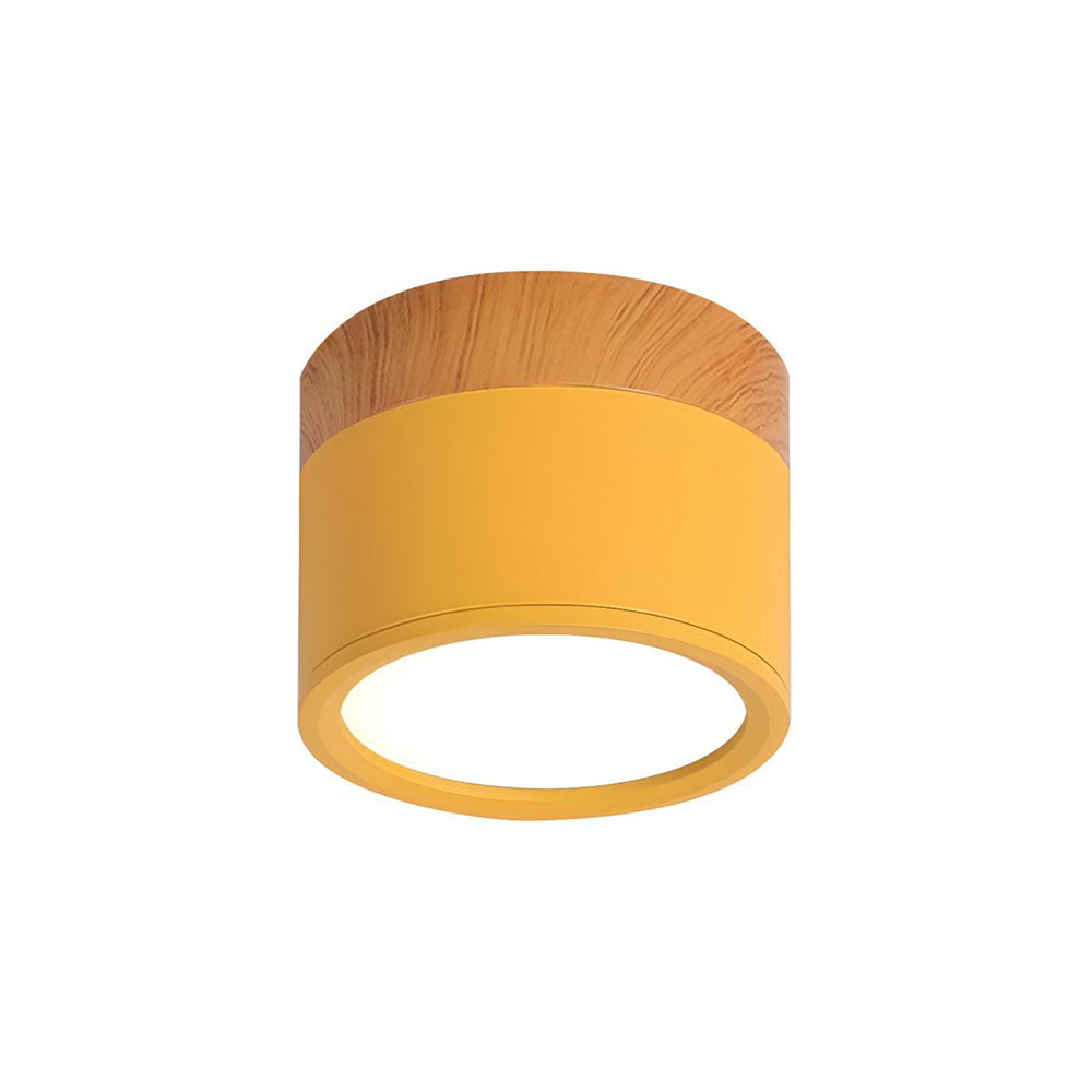Ceiling light fixture with yellow shade and wooden top on a white background