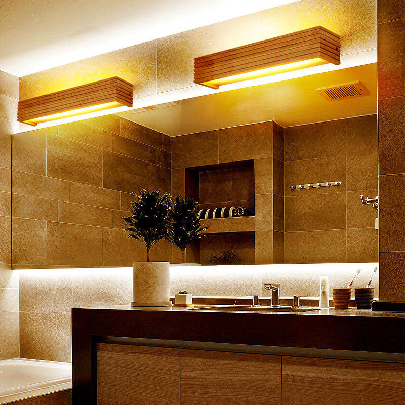 Modern bathroom with tiled walls, a sink, and decorative elements.