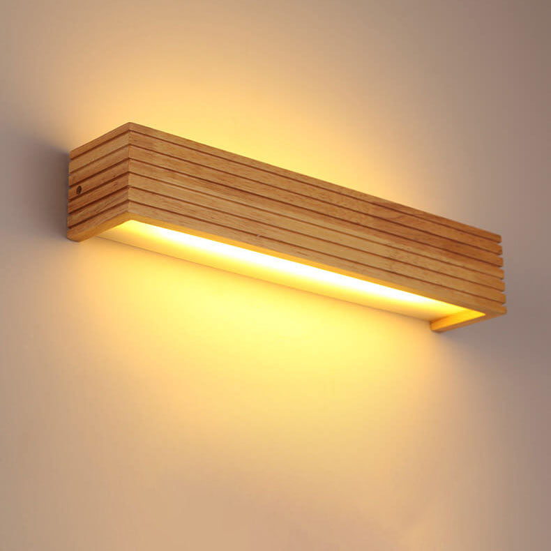 Wooden wall light fixture on a neutral background