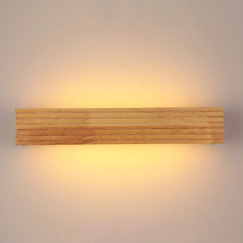 Wooden wall light fixture on a neutral background
