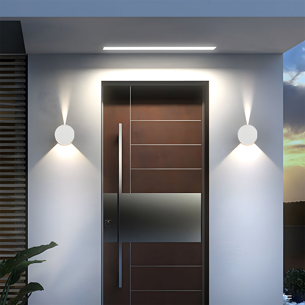 Modern door with metallic finish in a well-lit entrance area