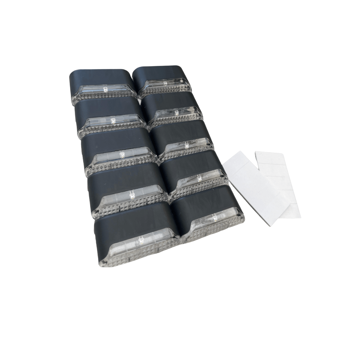 Set of black and gray foam pads on a white background