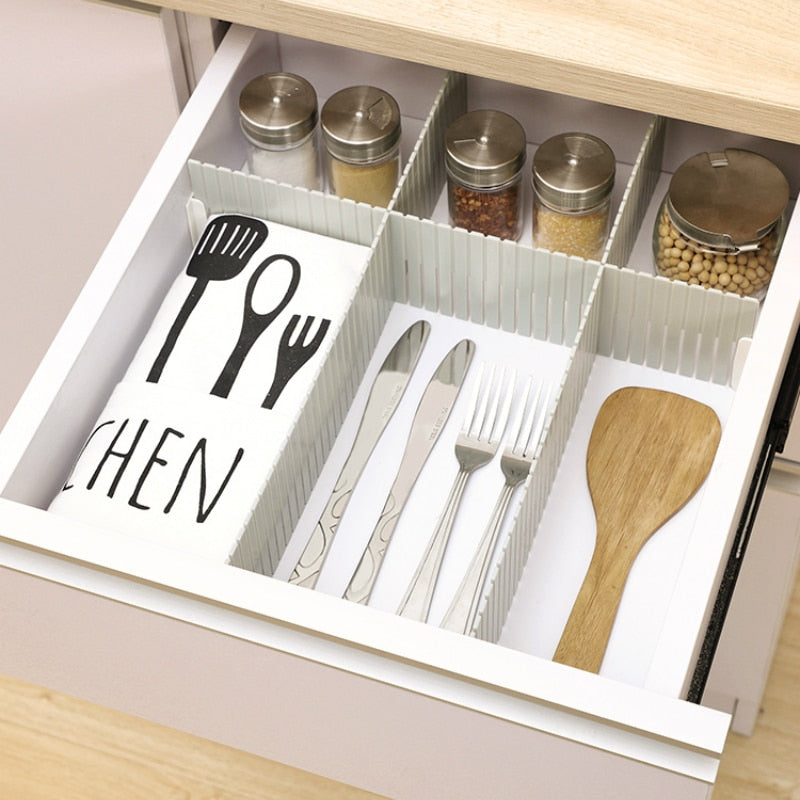 Kitchen drawer organizer with cutlery and spices