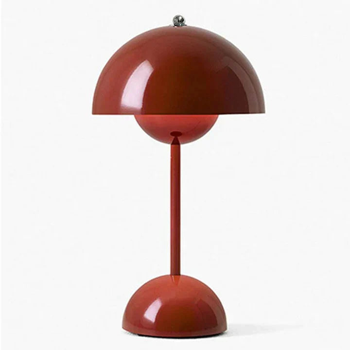 Red table lamp with a unique design on a white background