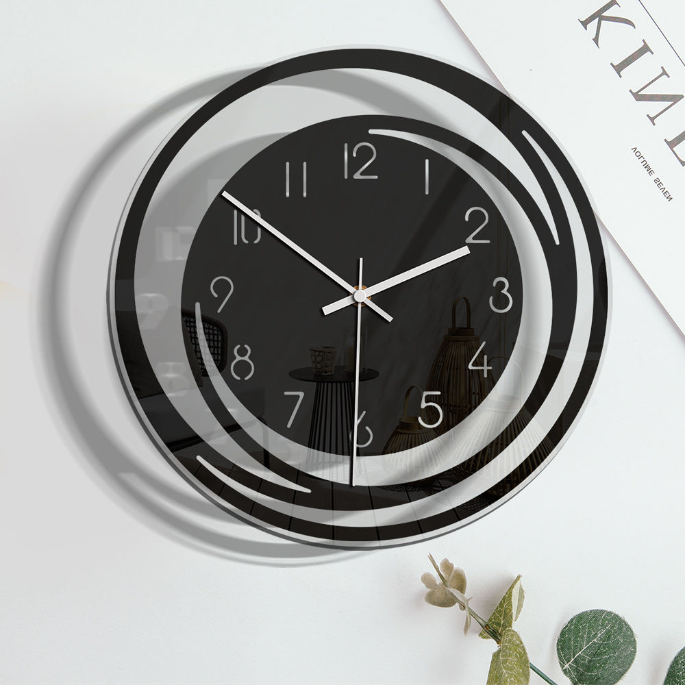Black and white wall clock on a light background