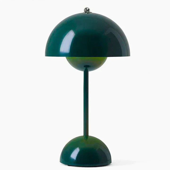 Green table lamp with a unique design on a white background
