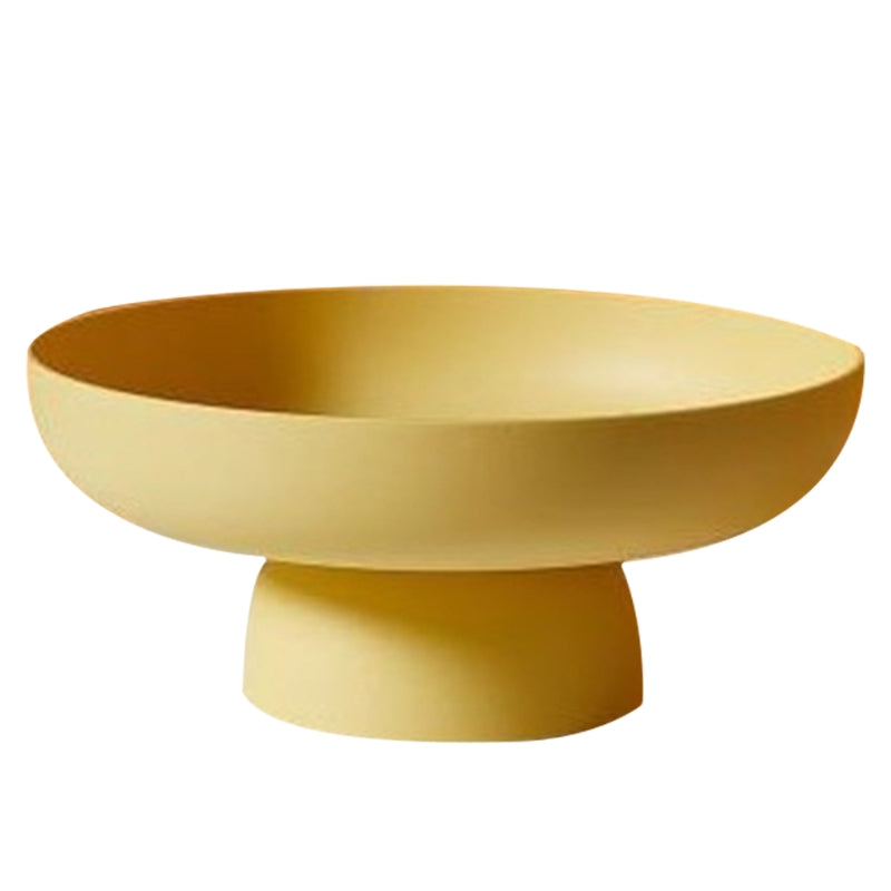 Yellow bowl with a pedestal base on a white background