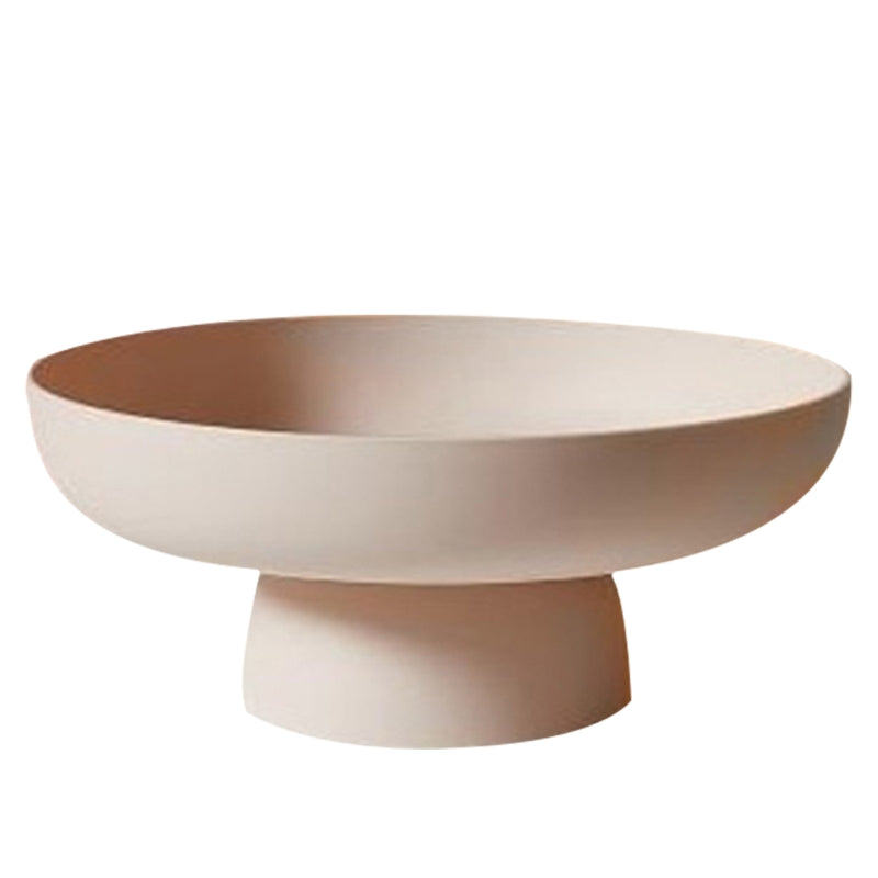 Round decorative bowl with a pedestal base on a white background