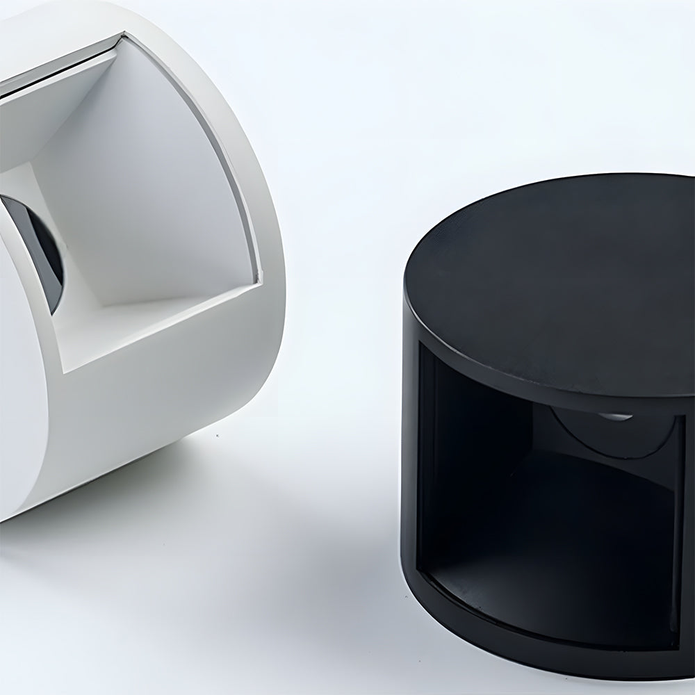 White and black cylindrical objects on a light gray background