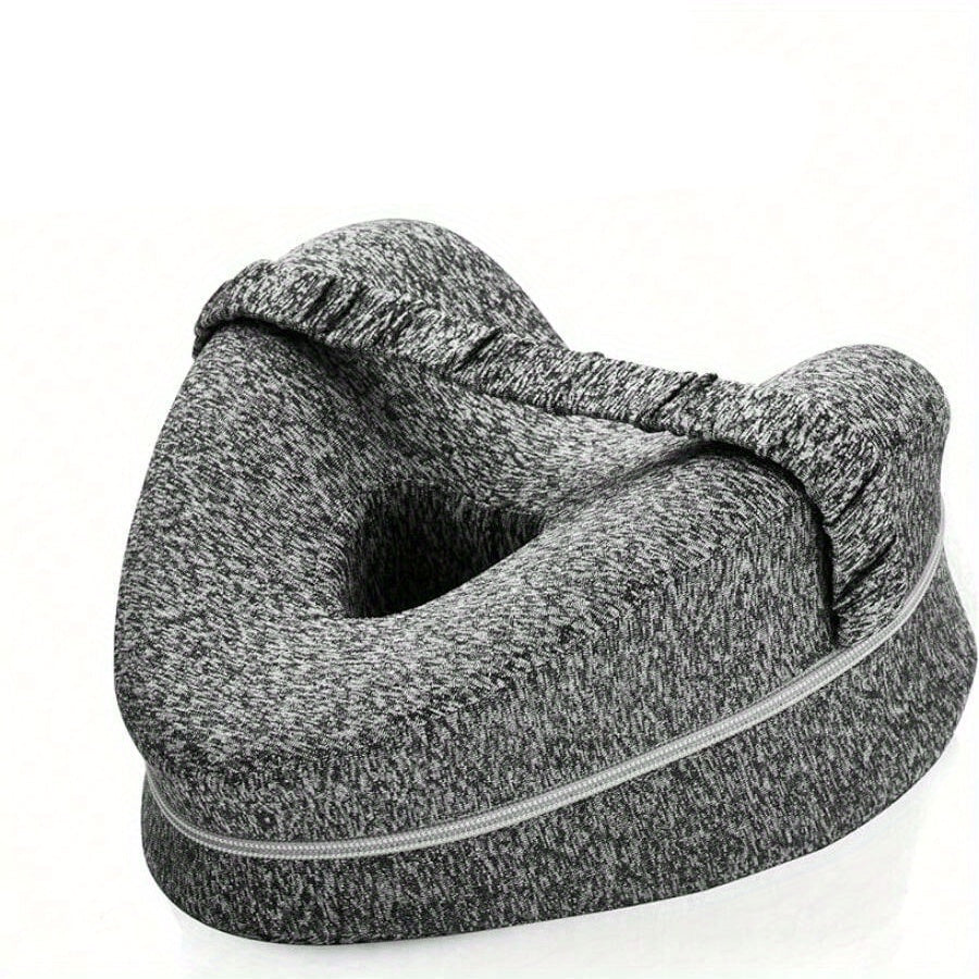 Gray U-shaped pillow with a person lying on a white background