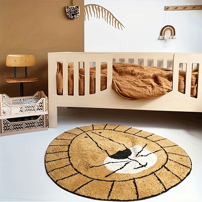 Round beige rug with a lion face design on a concrete floor.