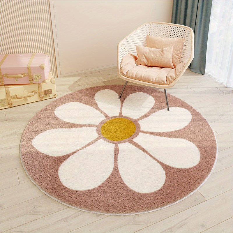 Round flower-shaped rug with a yellow center and white petals on a wooden floor.