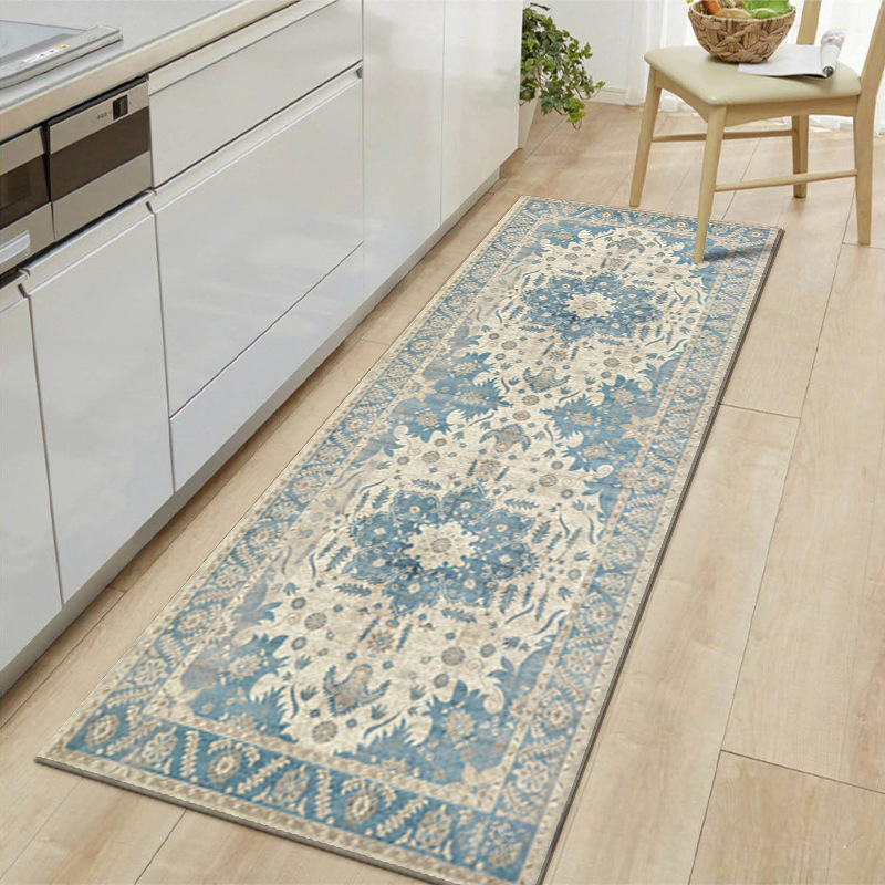Decorative blue and beige runner rug on a wooden floor in a kitchen setting.