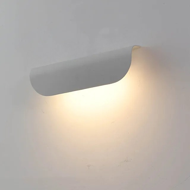 Wall-mounted light fixture on a plain wall