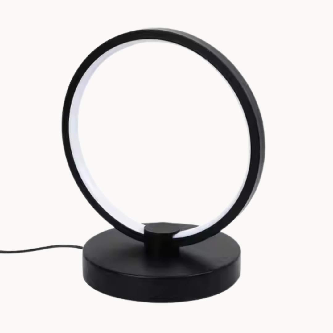 Black circular table lamp on a white background