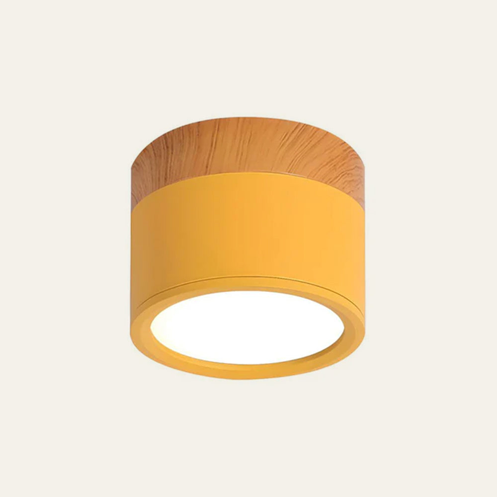 Ceiling light fixture with yellow shade and wooden top on a white background