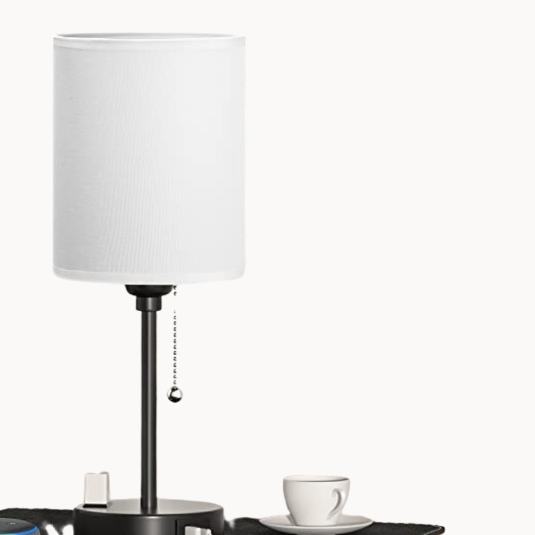 Table lamp with a white shade on a white background