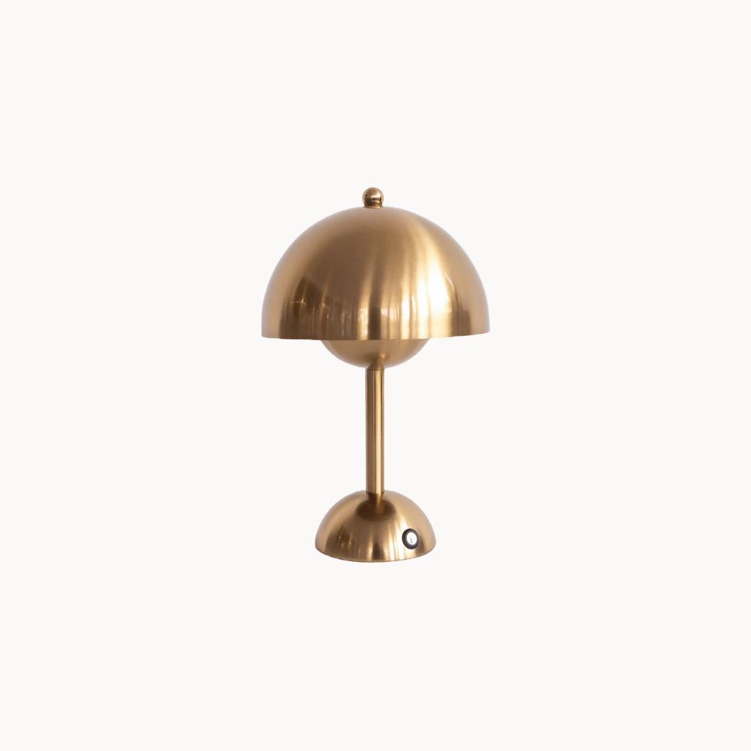 Gold table lamp on a white background