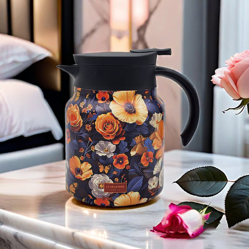 Floral-patterned thermos on a marble surface with decorative elements