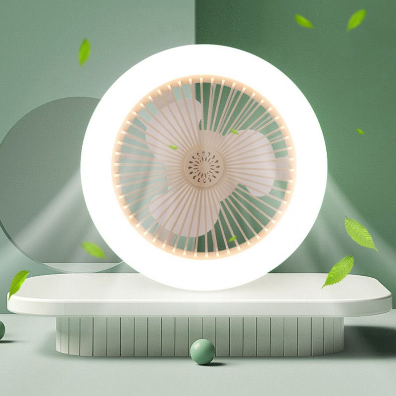 White fan on a green background with leaves