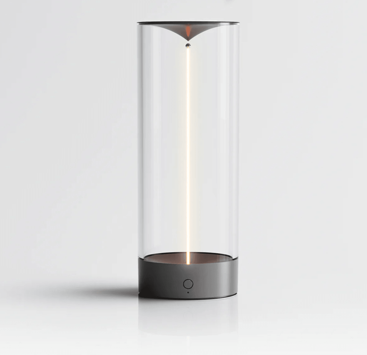 Modern cylindrical lamp with a clear glass cover on a light gray background