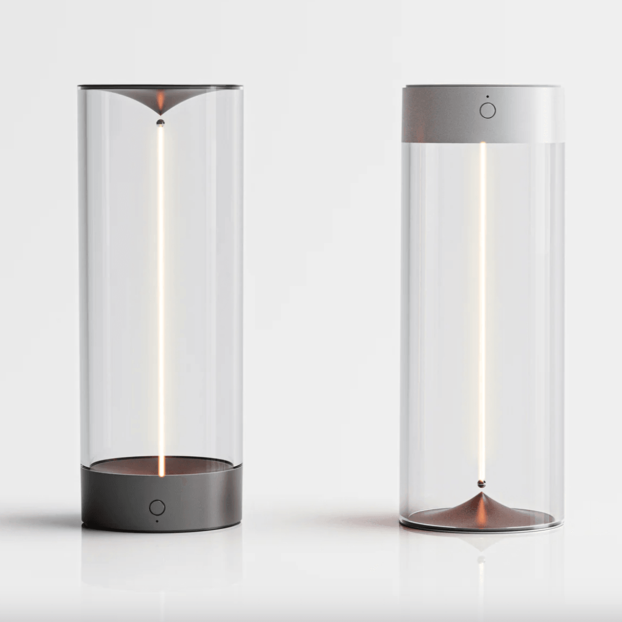 Two cylindrical lamps with glass covers on a white background
