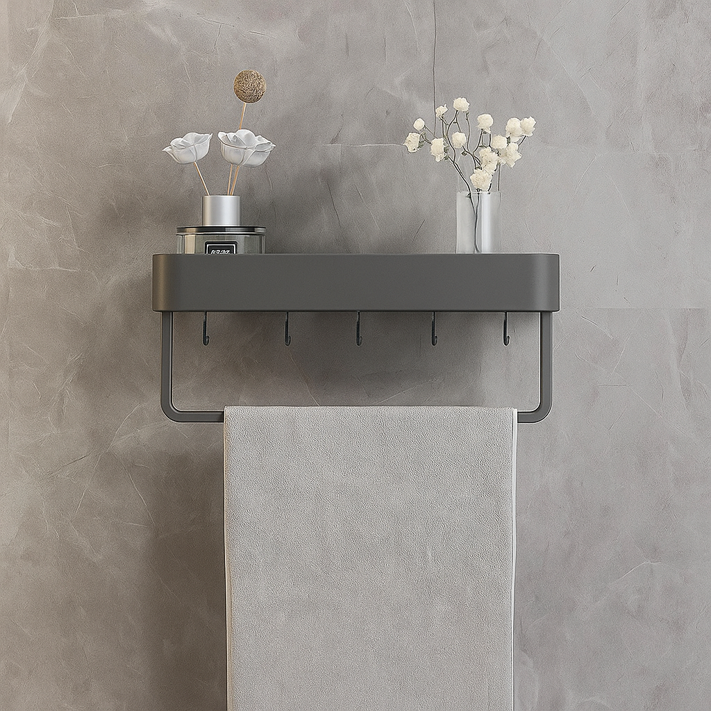 Towel holder with a towel hanging on a gray wall