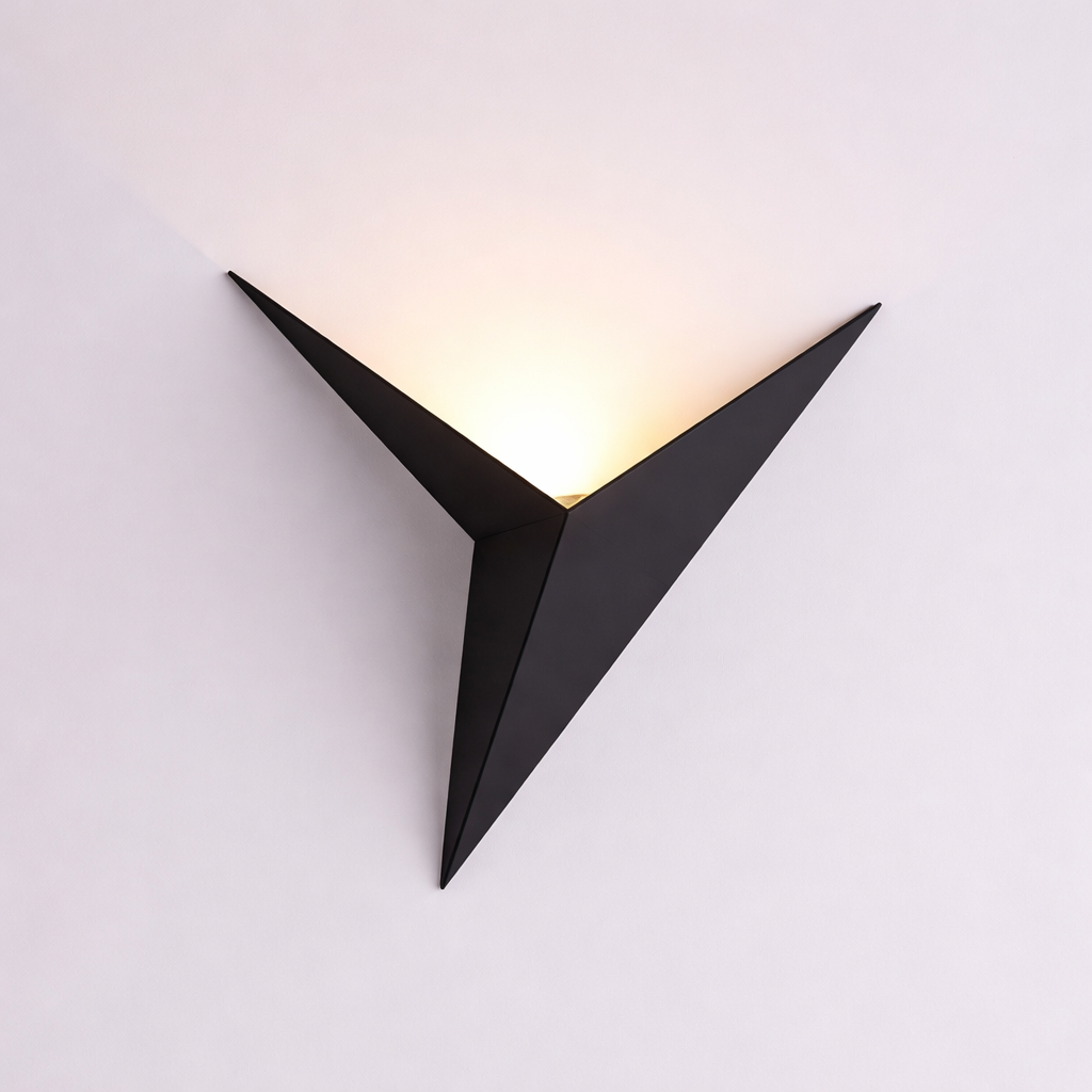 Modern black wall light fixture on a white background