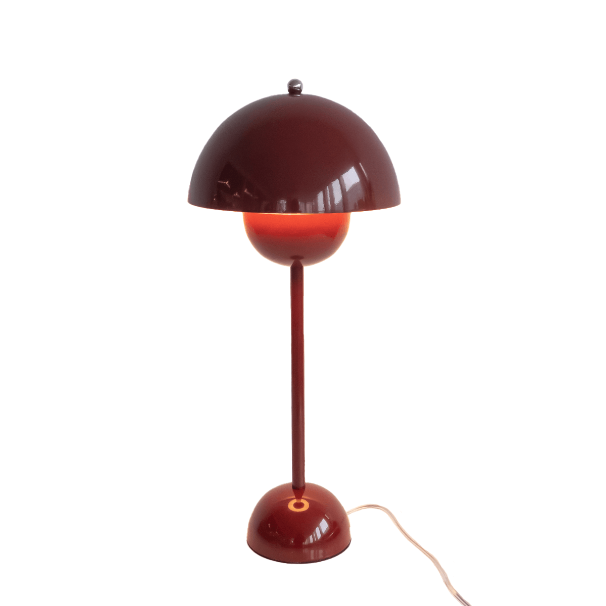 Red table lamp with a white background