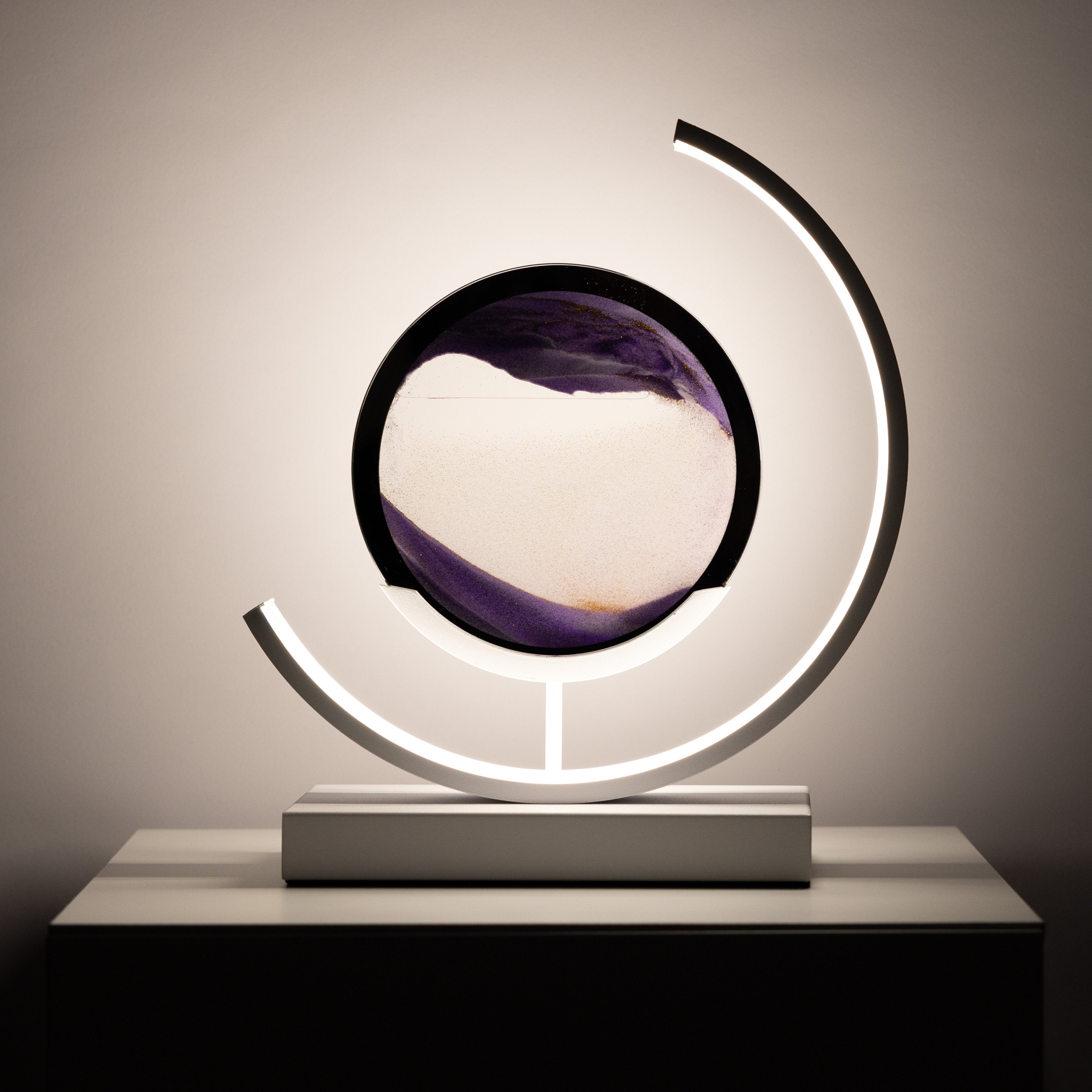 Decorative lamp with a circular design and light fixture on a neutral background