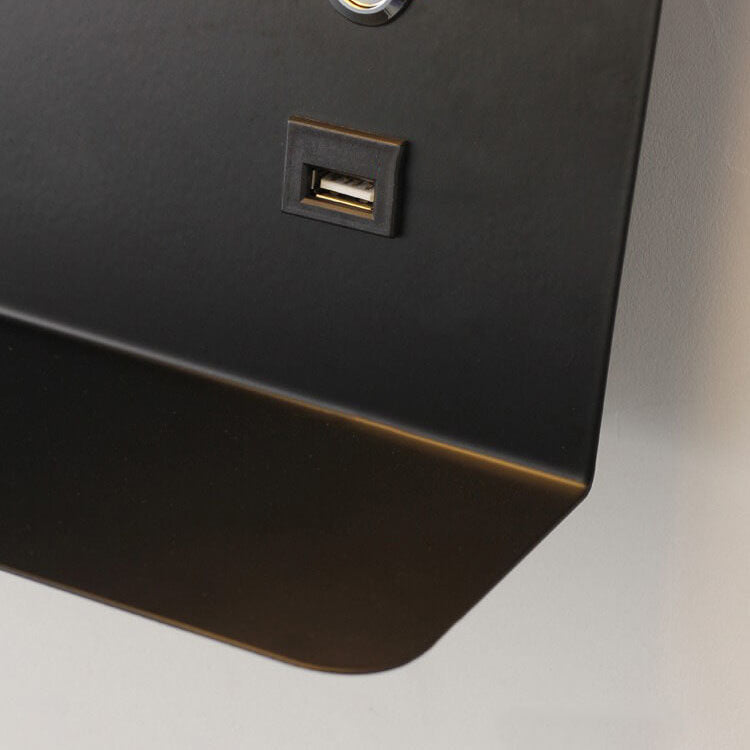 Close-up of a black surface with a USB port on a neutral background