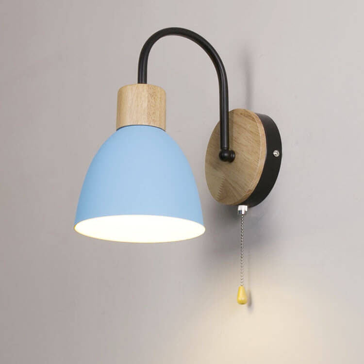 Wall-mounted lamp with blue shade and wooden accents on a gray background
