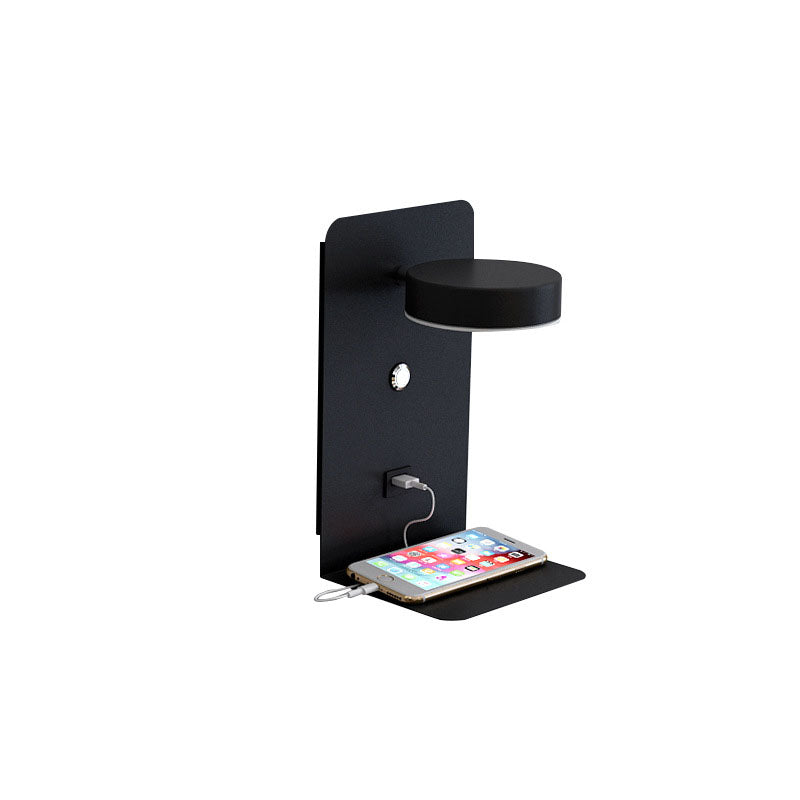 Black wall-mounted phone charging station with a smartphone on a white background