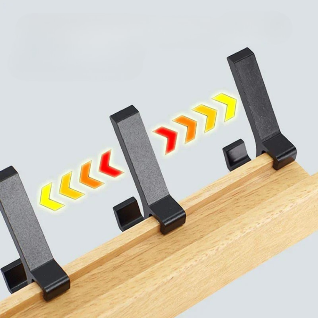 Black magnetic strip with temperature indicator on a wooden surface