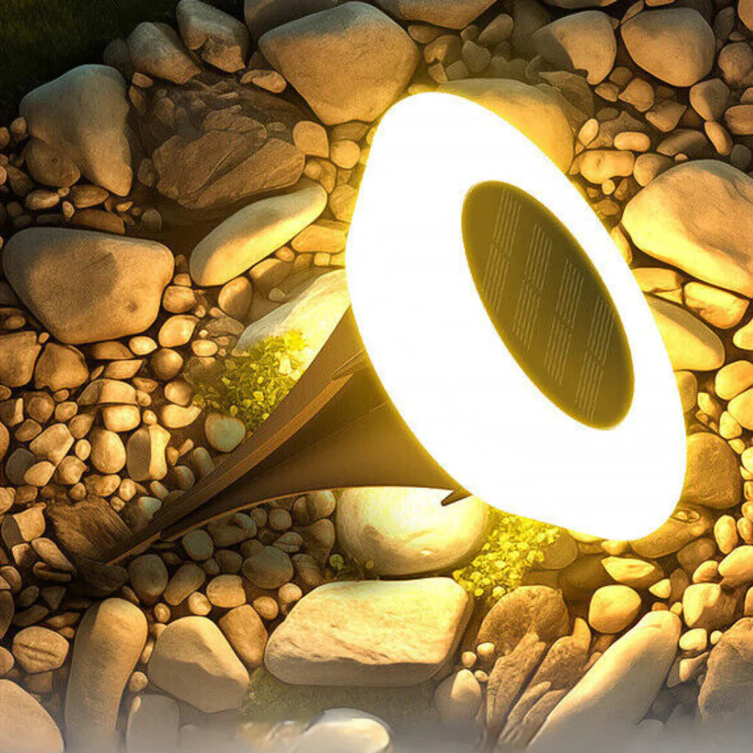 Solar-powered outdoor light embedded in pebbles