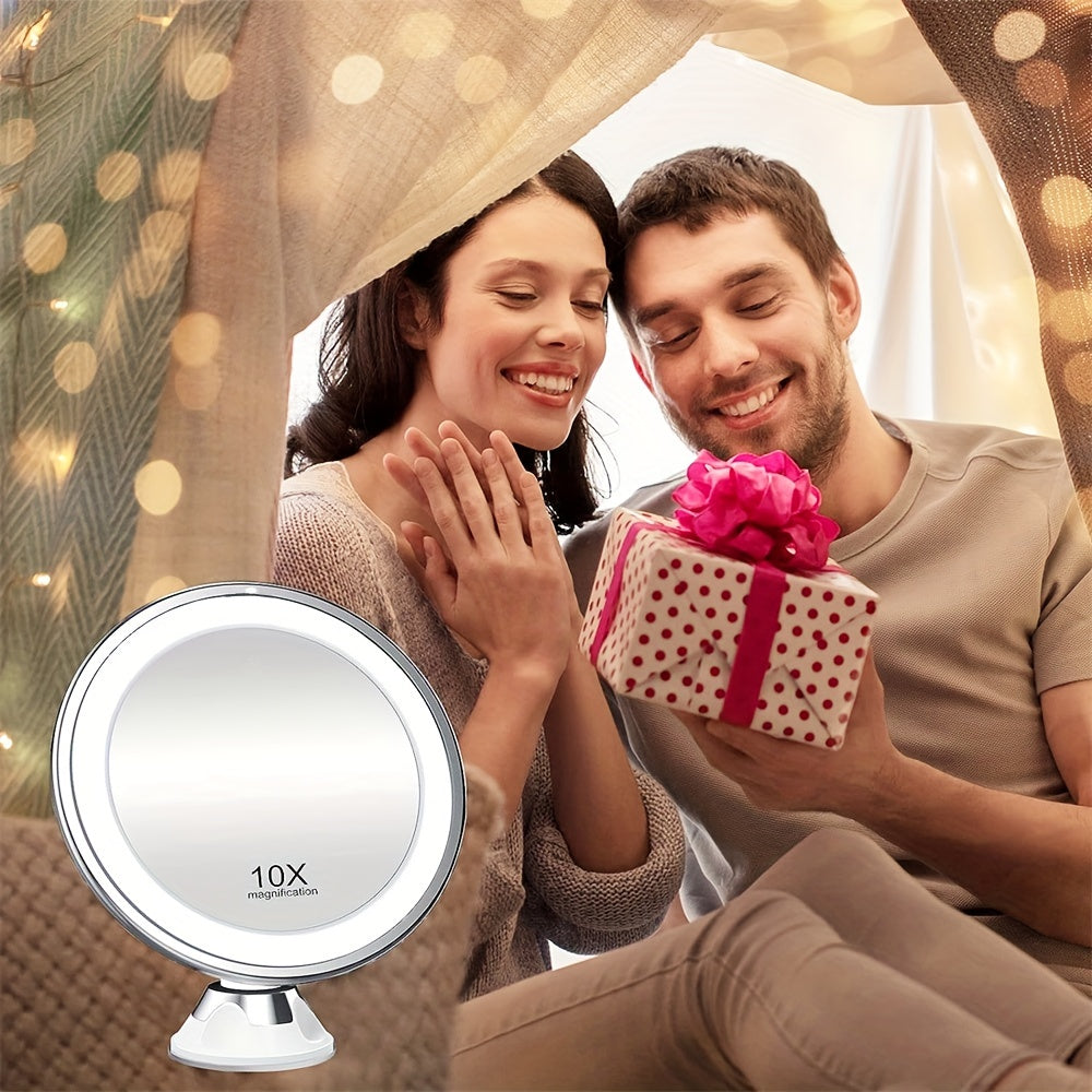 Couple under a blanket with a gift and a magnifying mirror in the foreground