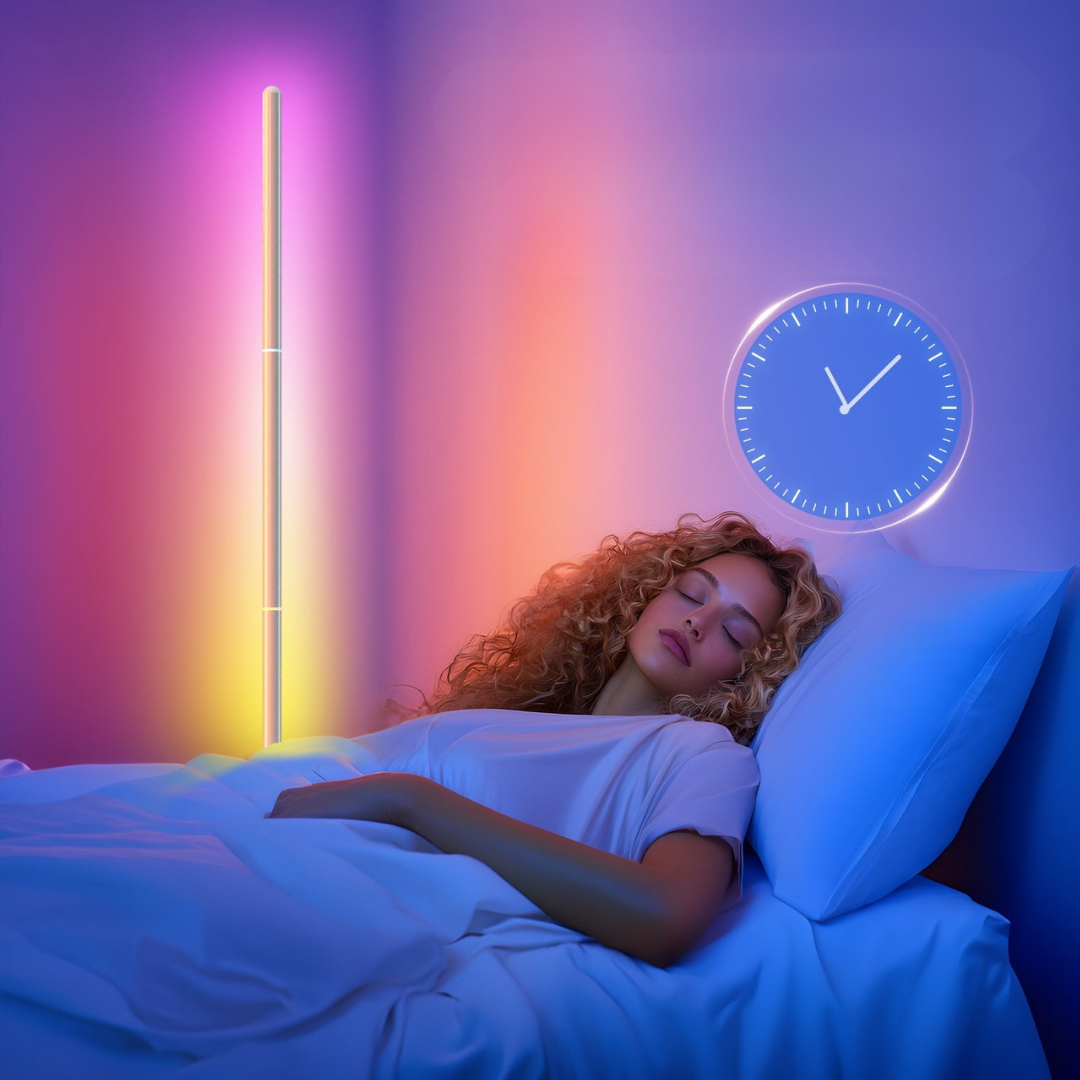 Woman sleeping in bed with a colorful light strip and clock on the wall.