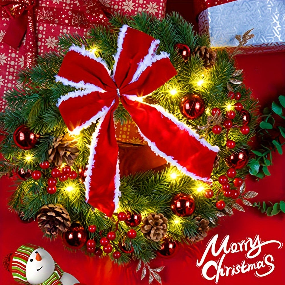 Decorative Christmas wreath with red bow and lights on a red background