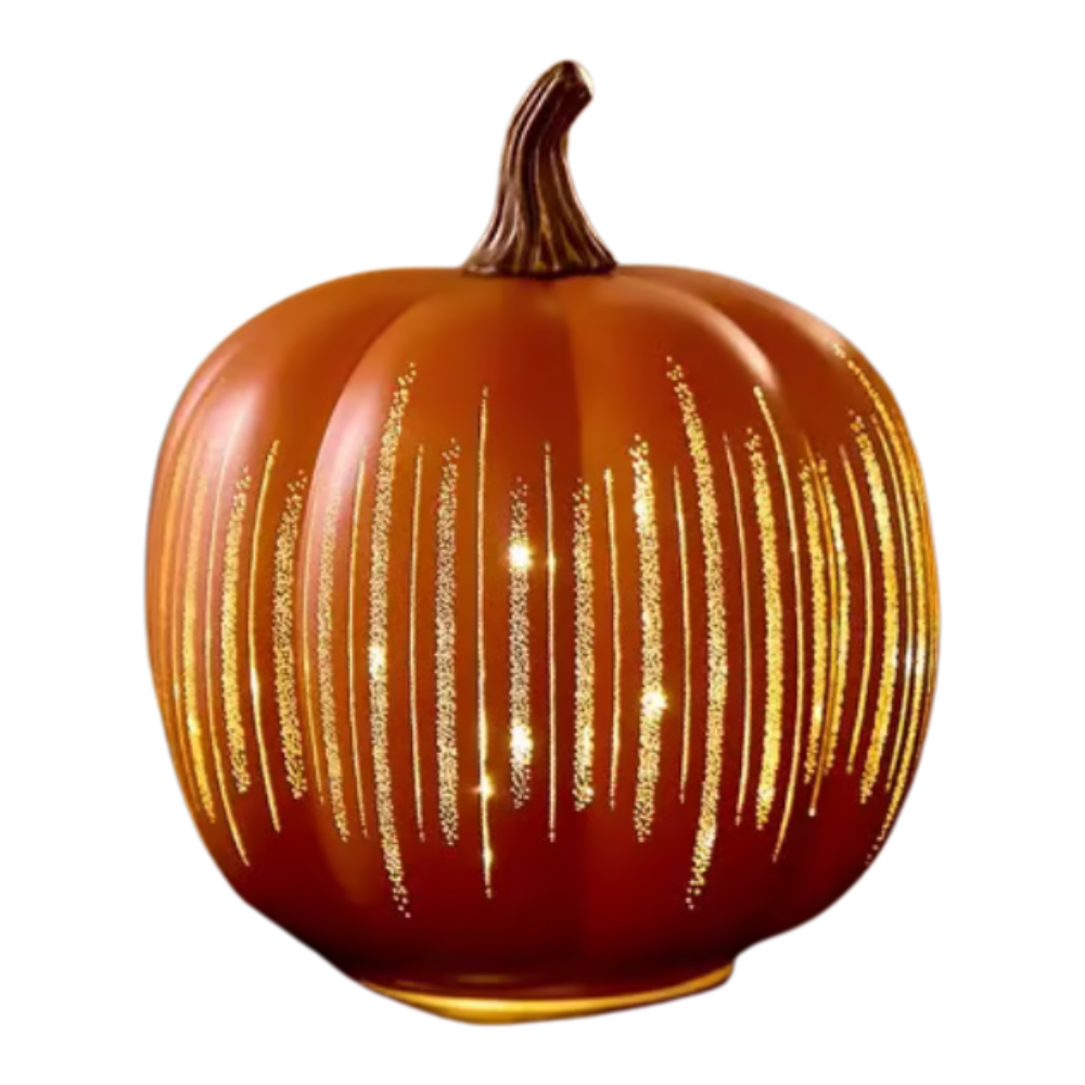 Decorative pumpkin with gold glitter stripes on a white background
