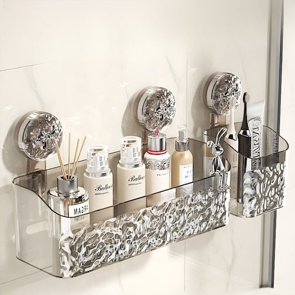 Bathroom shelf with decorative glass and metal accents holding various bottles.