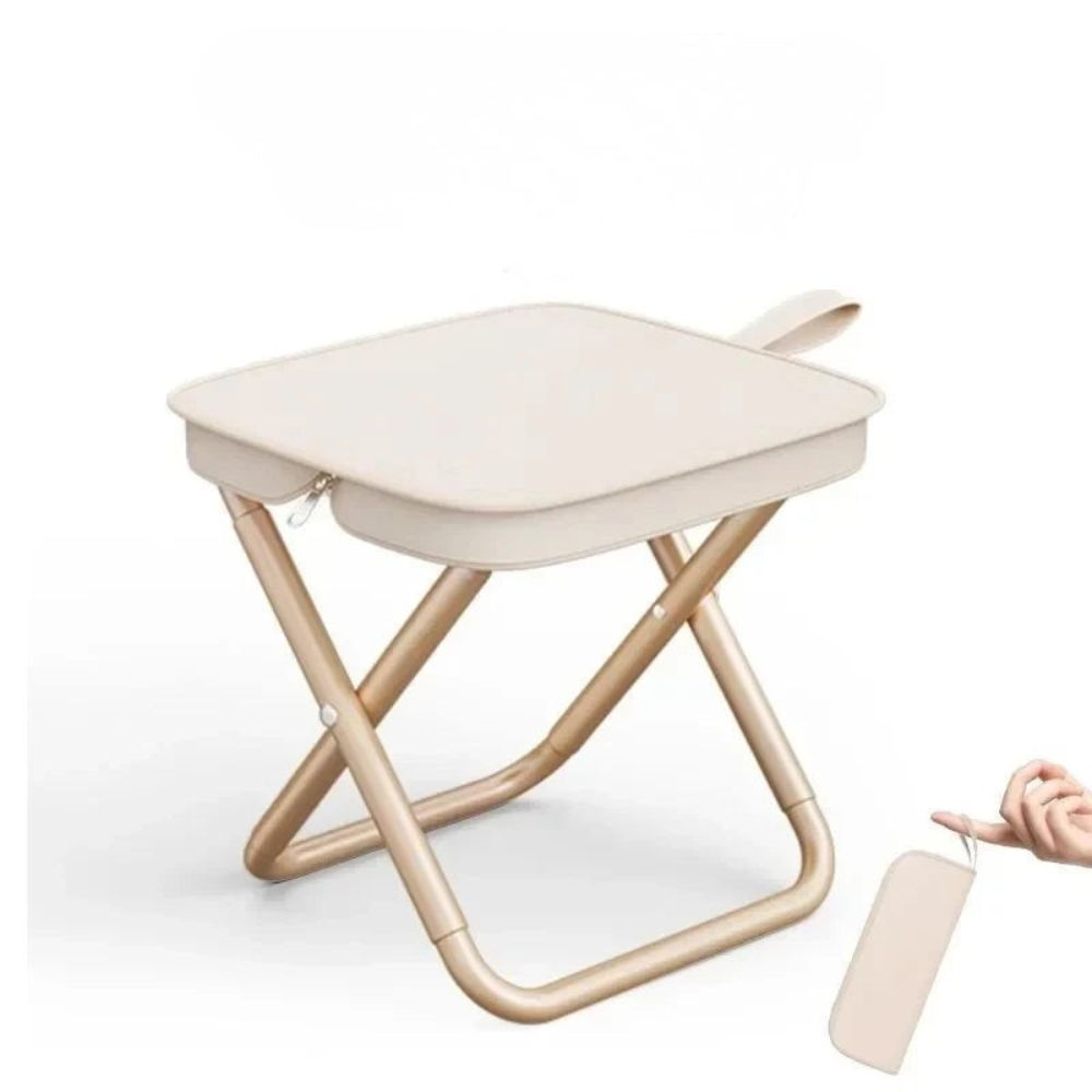 Foldable stool with beige seat and wooden frame on a white background